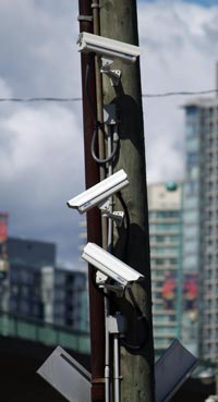 Photo of three surveillance cameras on a utility pole in downtown Vancouver.