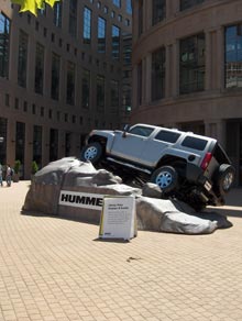 Photo of a Hummer on display in the plaza at the Vancouver Public Library main branch.